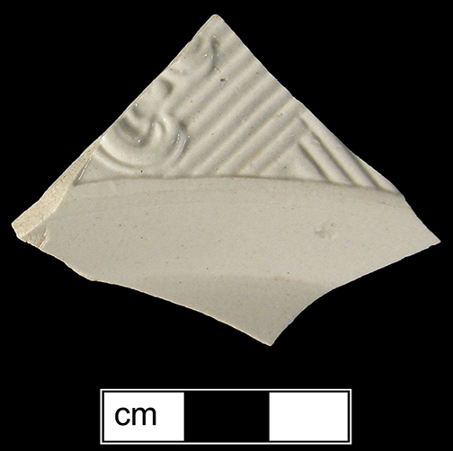 Plate rim sherd from 18QU124, molded with what is most likely the Chinese rail/basket  pattern shown here in a whole plate example from(Skerry and Hood), Lot 32.